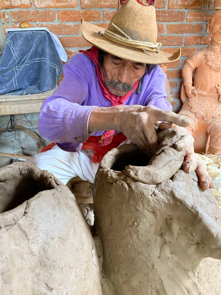 Blind sculptor Don José Garcia making a pot in his Oaxacan workshop
