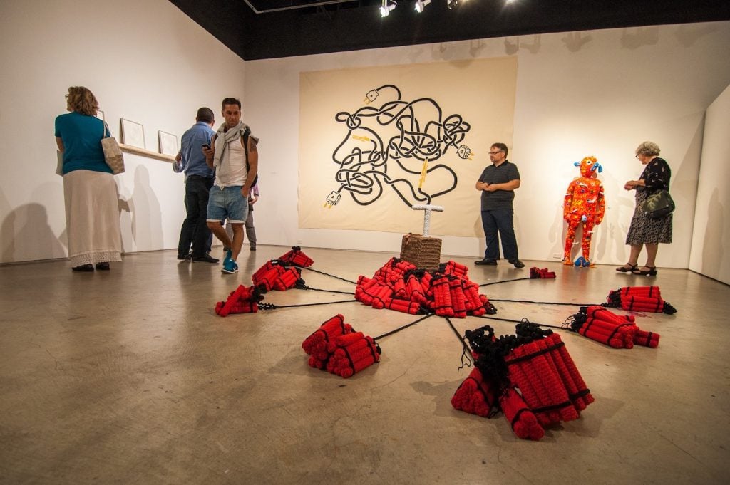 Interior of the Institute of Contemporary Art San Diego featuring an exhibit with fake dynamite and trigger along with other modern art in Balboa Park, San Diego